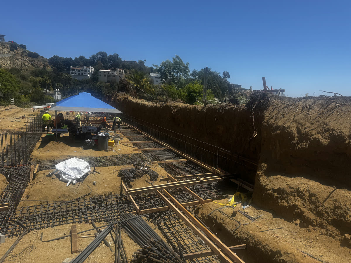 Rebar and formwork for a hillside foundation on a new build