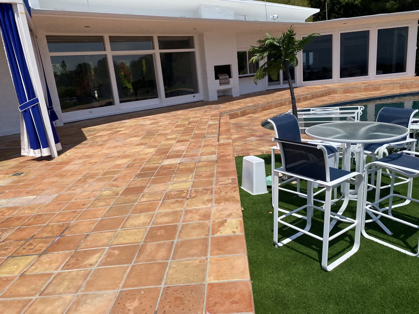 Restored terracotta tile patio and pool coping masonry
